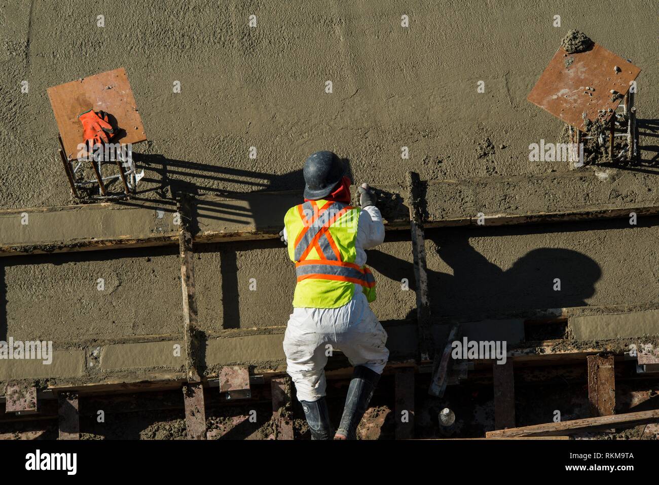 A construction worker at Vancouver House, a tower under construction in