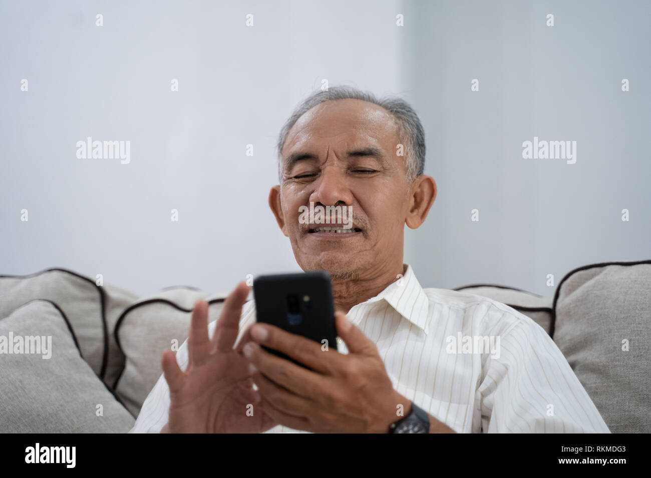 Asian mature male using hi-res stock photography and images - Alamy