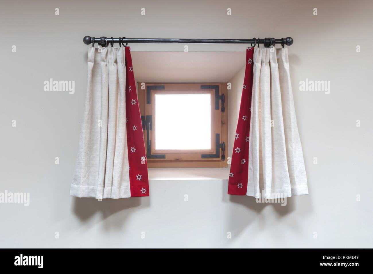 House interior - A small window with curtains - Alps Stock Photo - Alamy