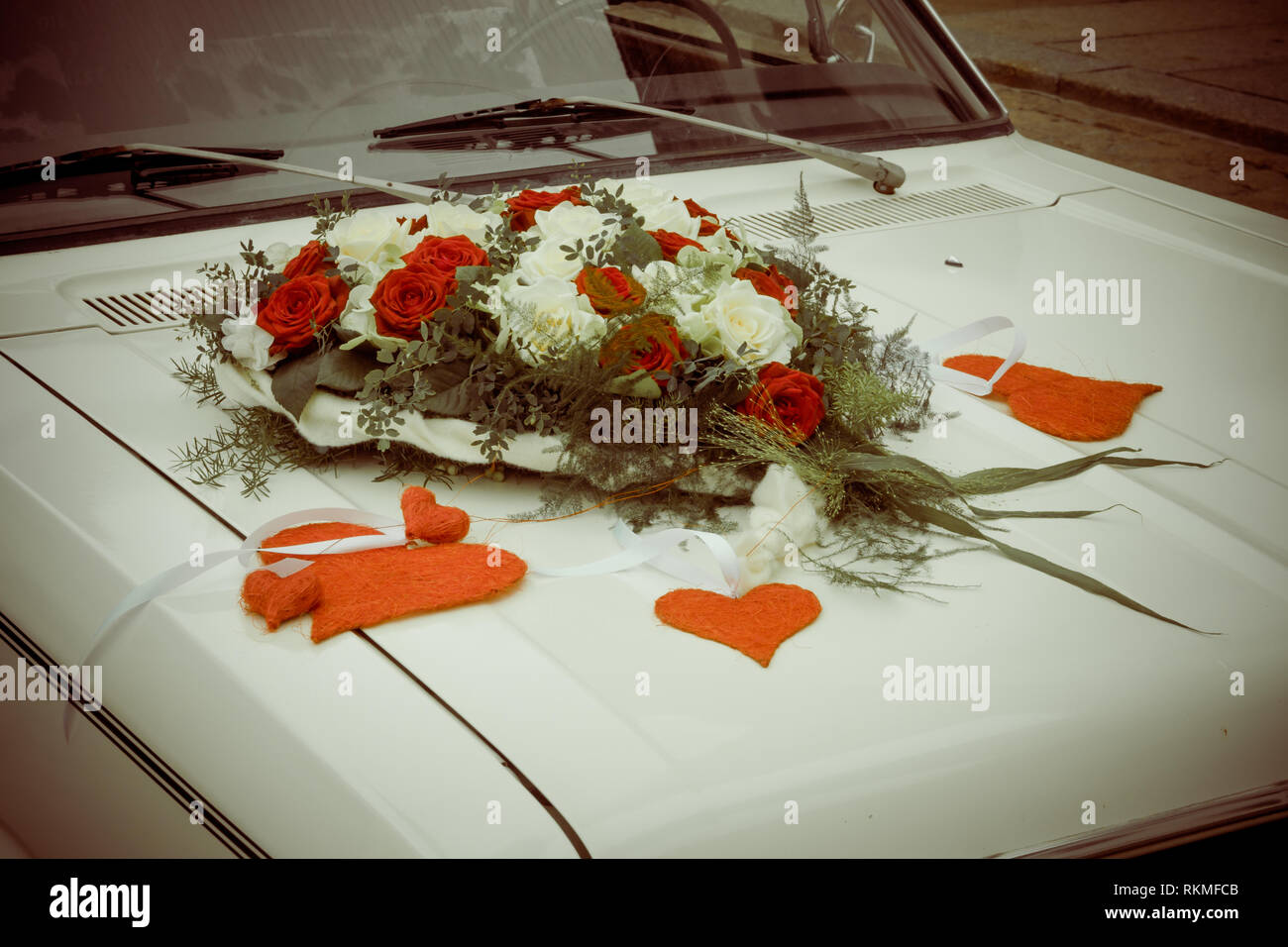 Car decoration for a wedding. Decorations on the car of the