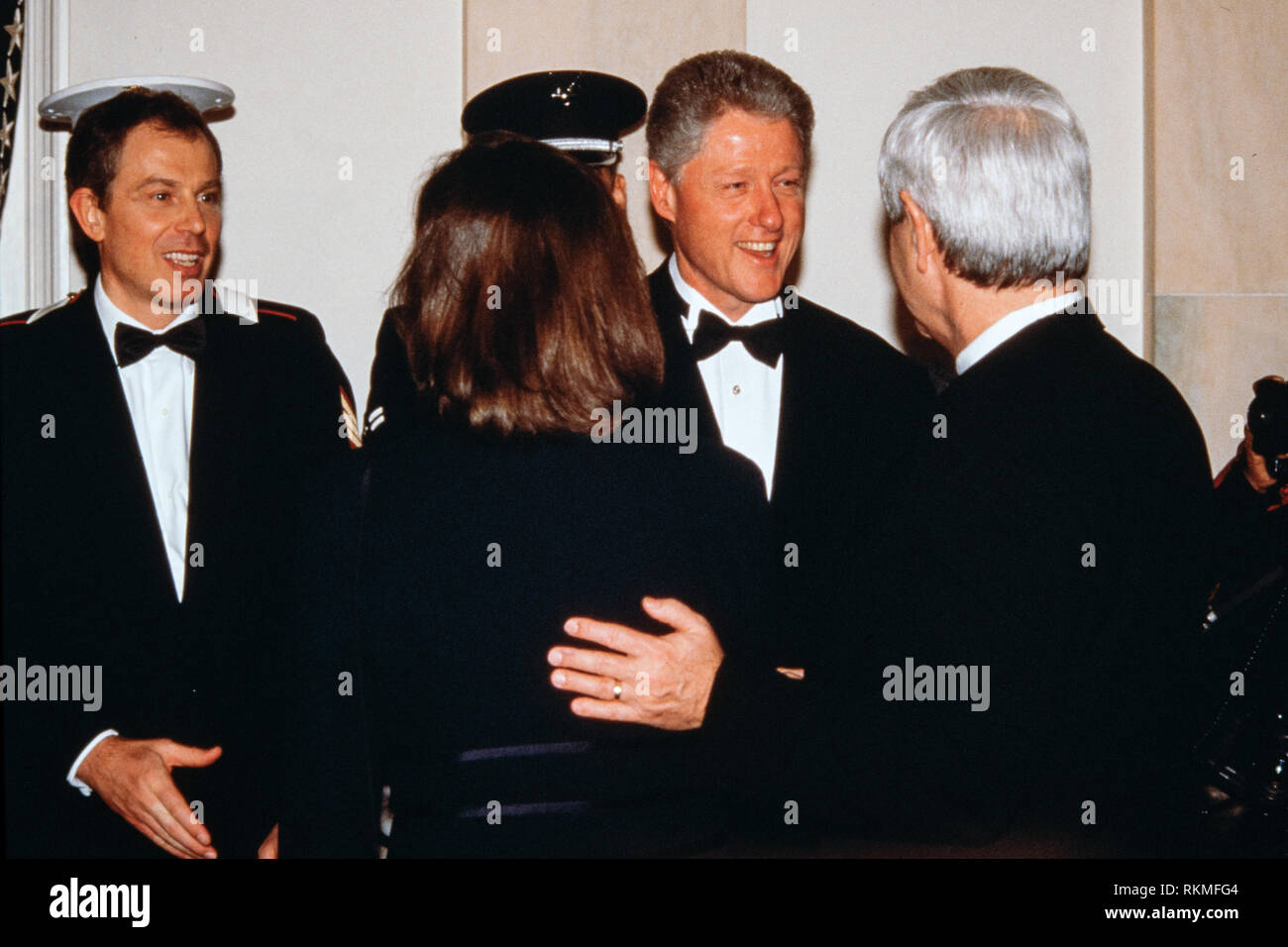 U.S. President Bill Clinton, center, and British Prime Minister Tony Blair, left, welcome Speaker Newt Gingrich, right, and his wife Marianne Ginther in the receiving line during the State Dinner at the White House February 5, 1998 in Washington, DC. Stock Photo