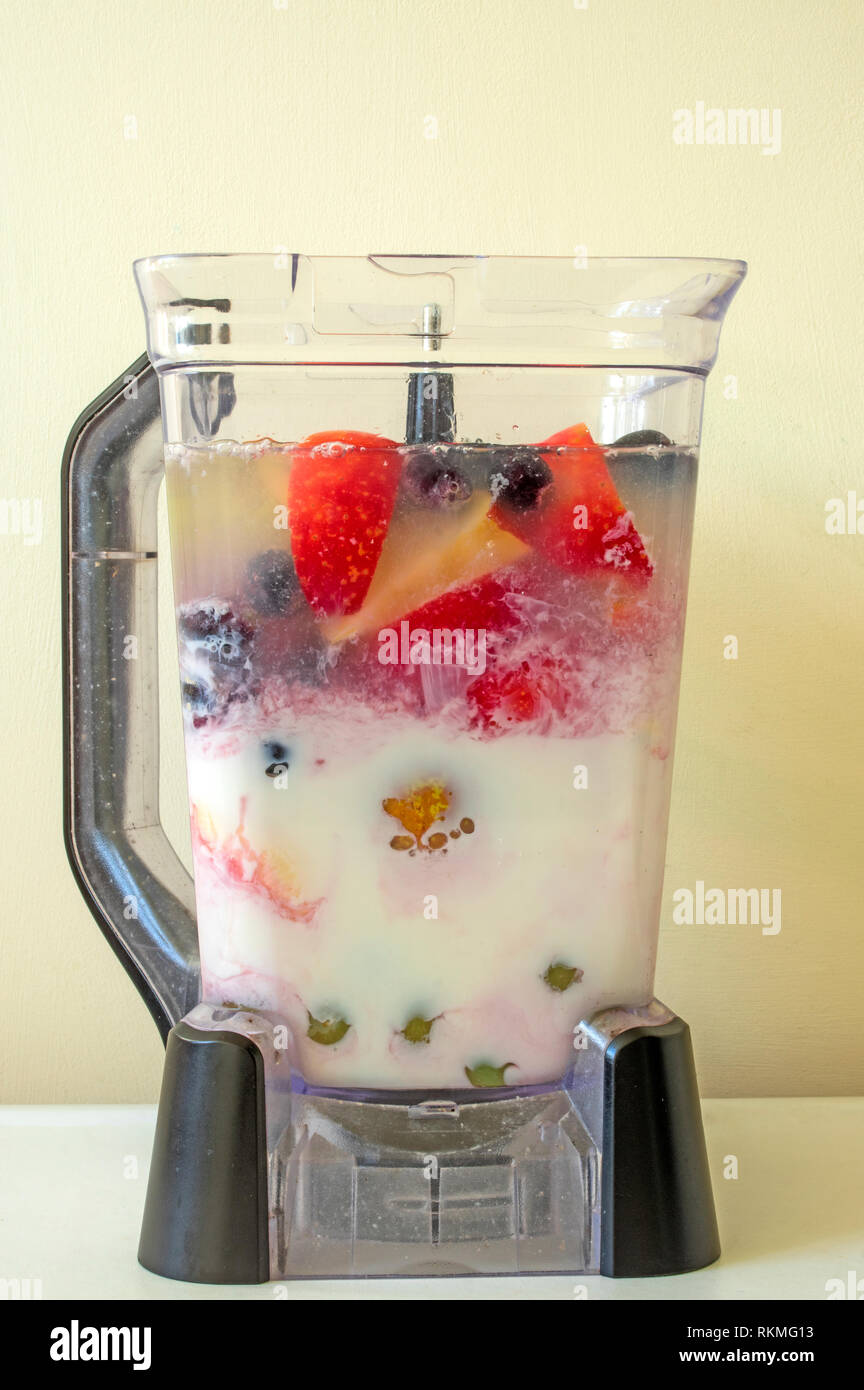 Milk and fruit juice have now been added Stock Photo Alamy