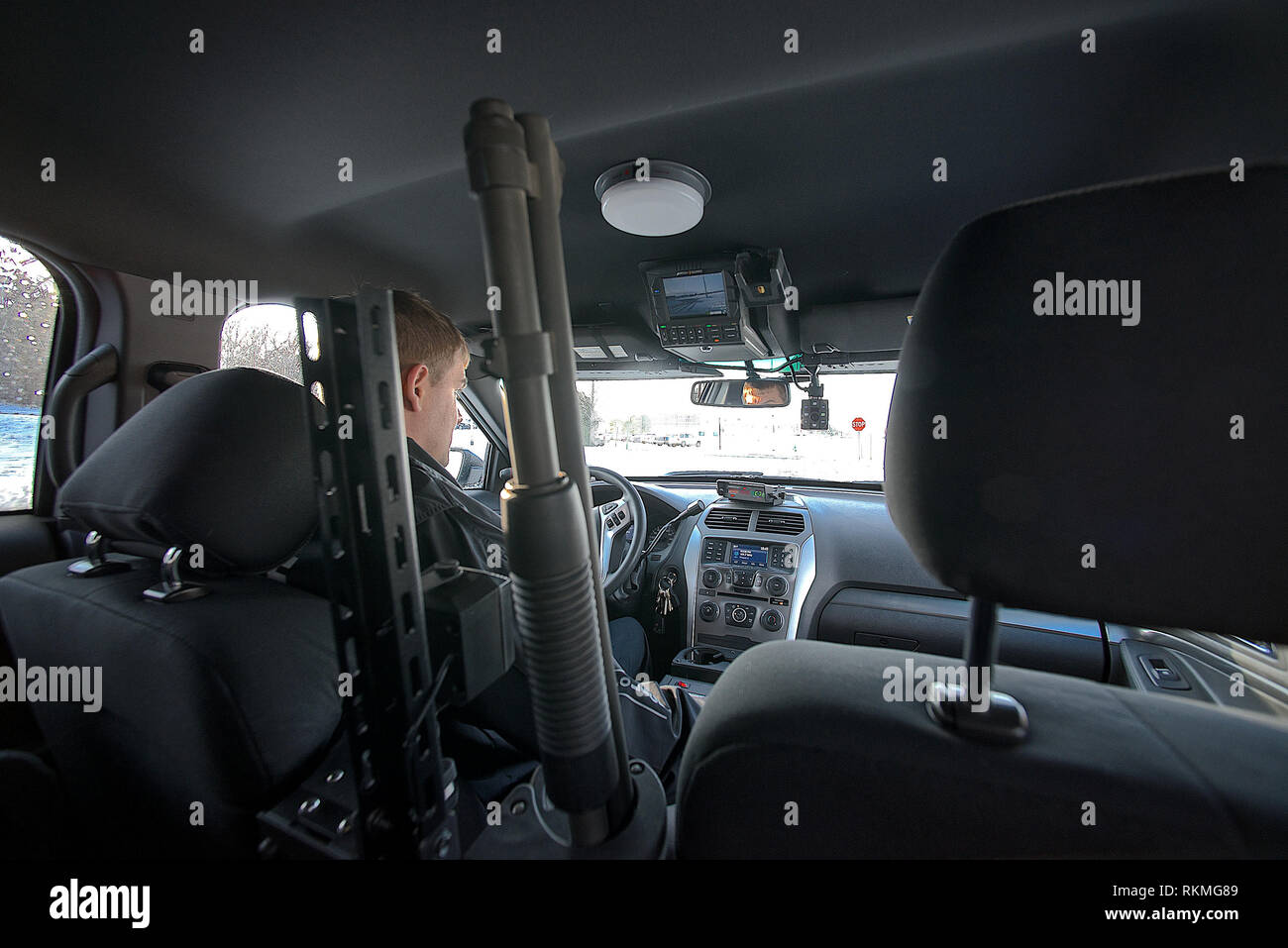 Emporia, Kansas USA February 17, 2015 4:48pm Officer Schuman inside the new  police cruiser. Which is equipped with speed radar, 3 different radio  systems to be able to communicate with campus ,