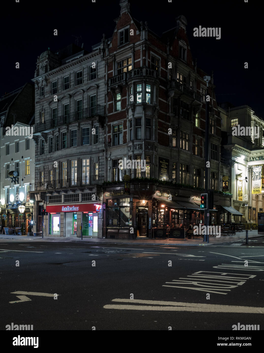 Night streets in London. Strand street exit to Waterloo Bridge. Stock Photo