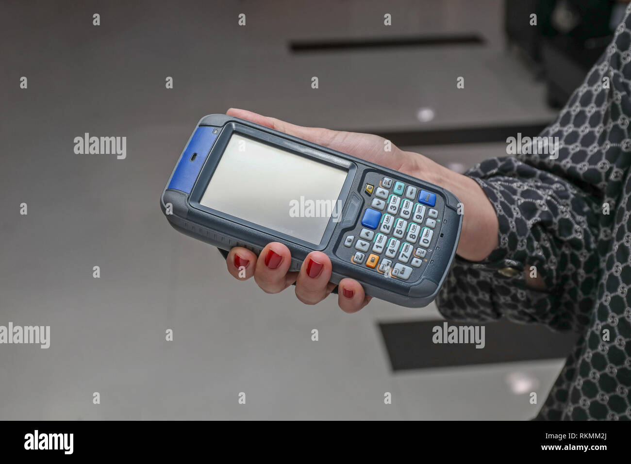 Woman Using Portable Barcode Scanner and Rfid Reader Device Stock Photo