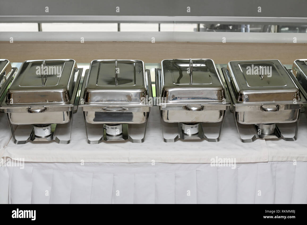 Stainless hotel pans on food warmers with various meals. Roasted meat  pieces with vegetable. Self-service buffet table. Celebration, party,  wedding Stock Photo - Alamy
