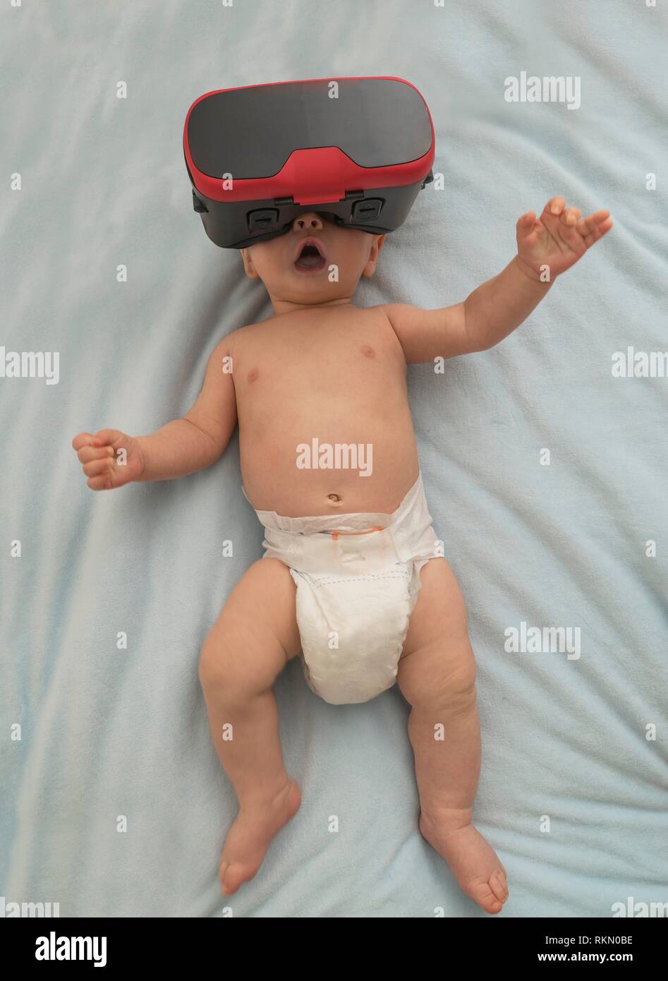 4 months old baby wearing googles Stock Photo