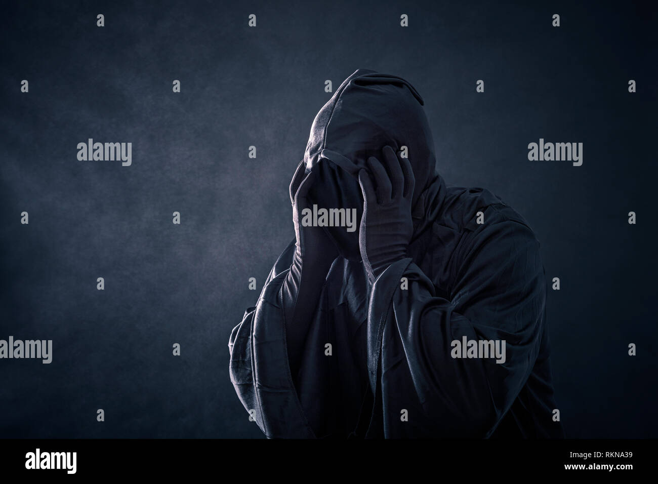 Scary figure in hooded cloak hi-res stock photography and images - Alamy