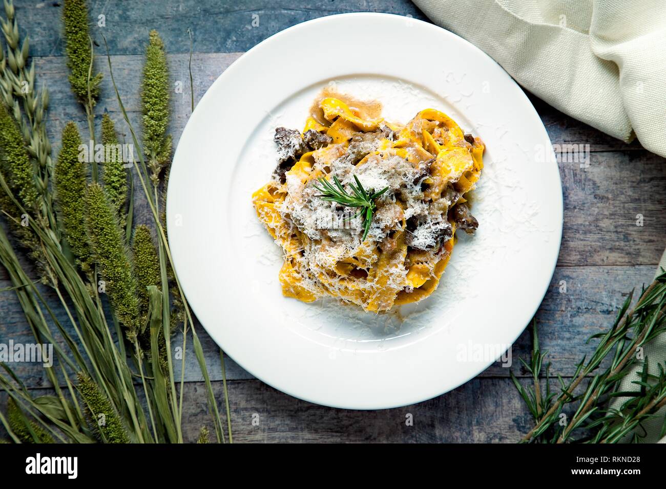Handmade plate ofr pappardelle pasta served with truffle and shaved