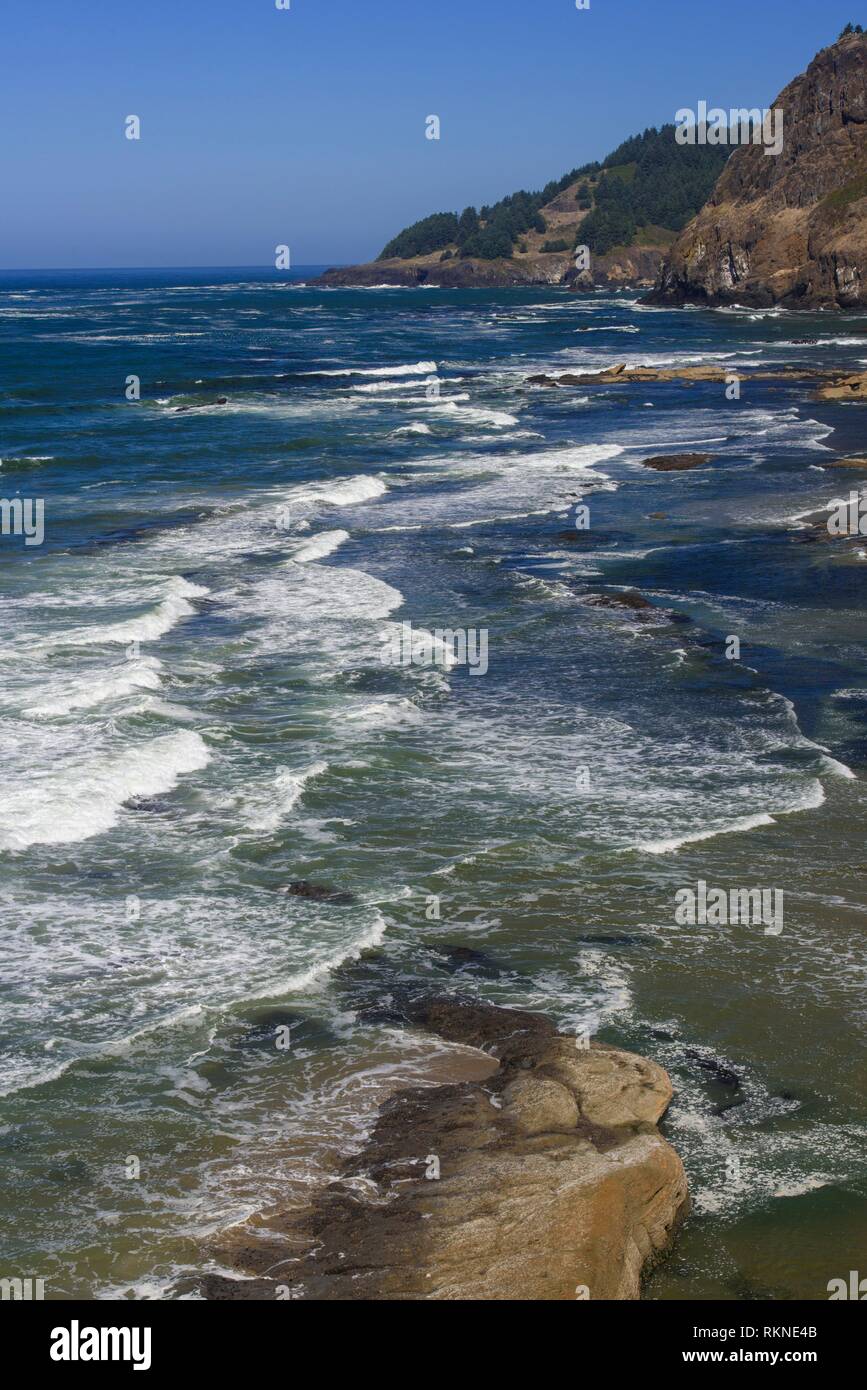 Rugged coastline with pounding surf, Devil's Punchpbowl Viewpoint, Oregon, USA. Stock Photo