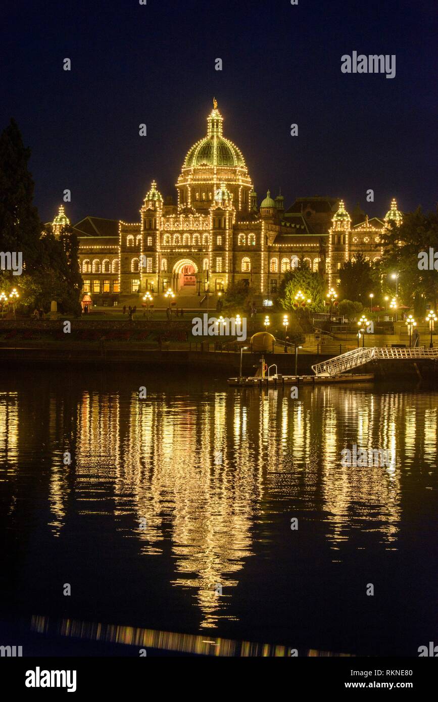 Night lights on British Columbia Parliament Buildings reflected in Victoria's Inner Harbour, , British Columbia, Canada. Stock Photo