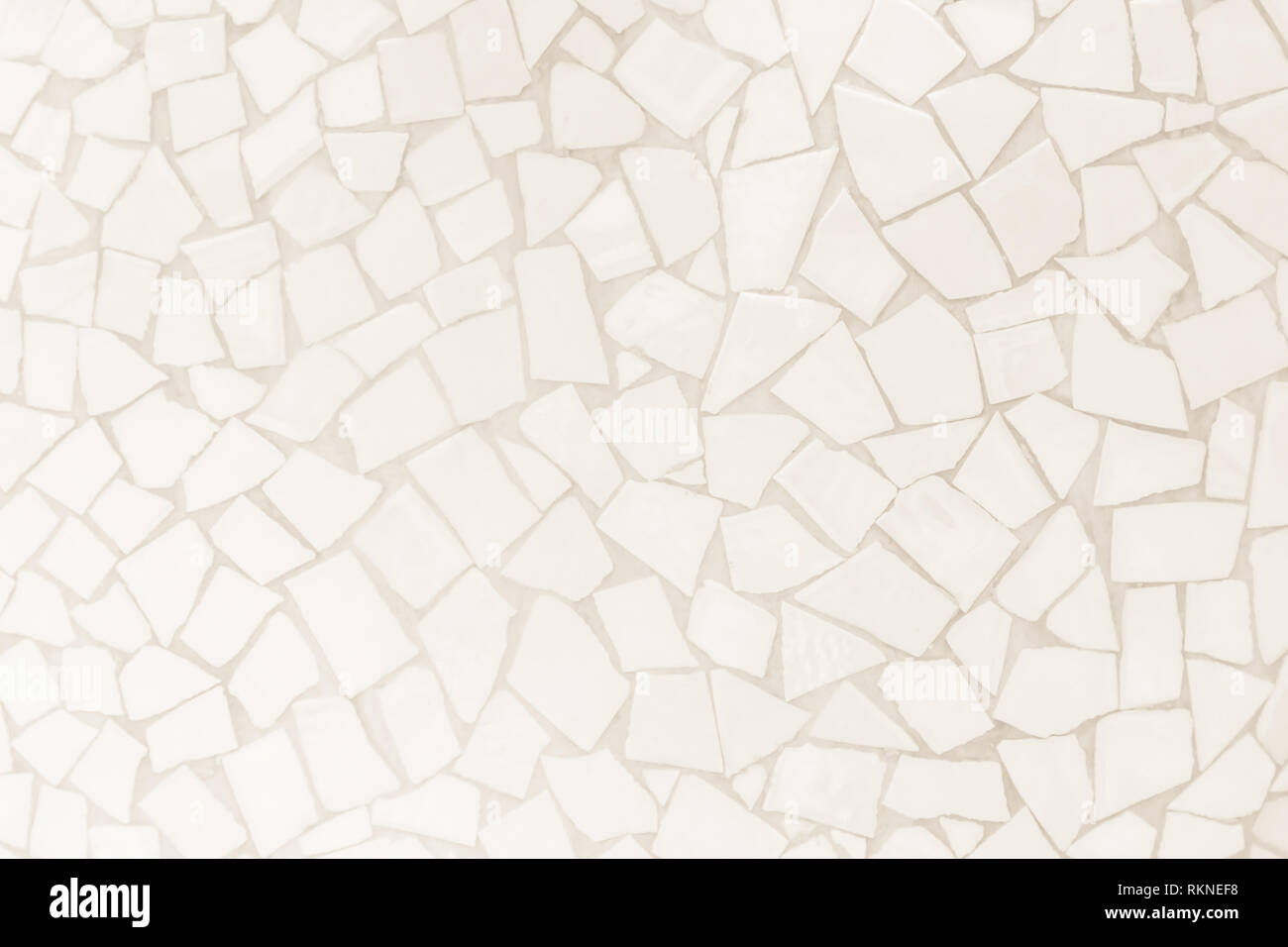 Broken tiles mosaic seamless pattern. Cream tile wall high resolution real photo or brick seamless and texture interior background. Stock Photo