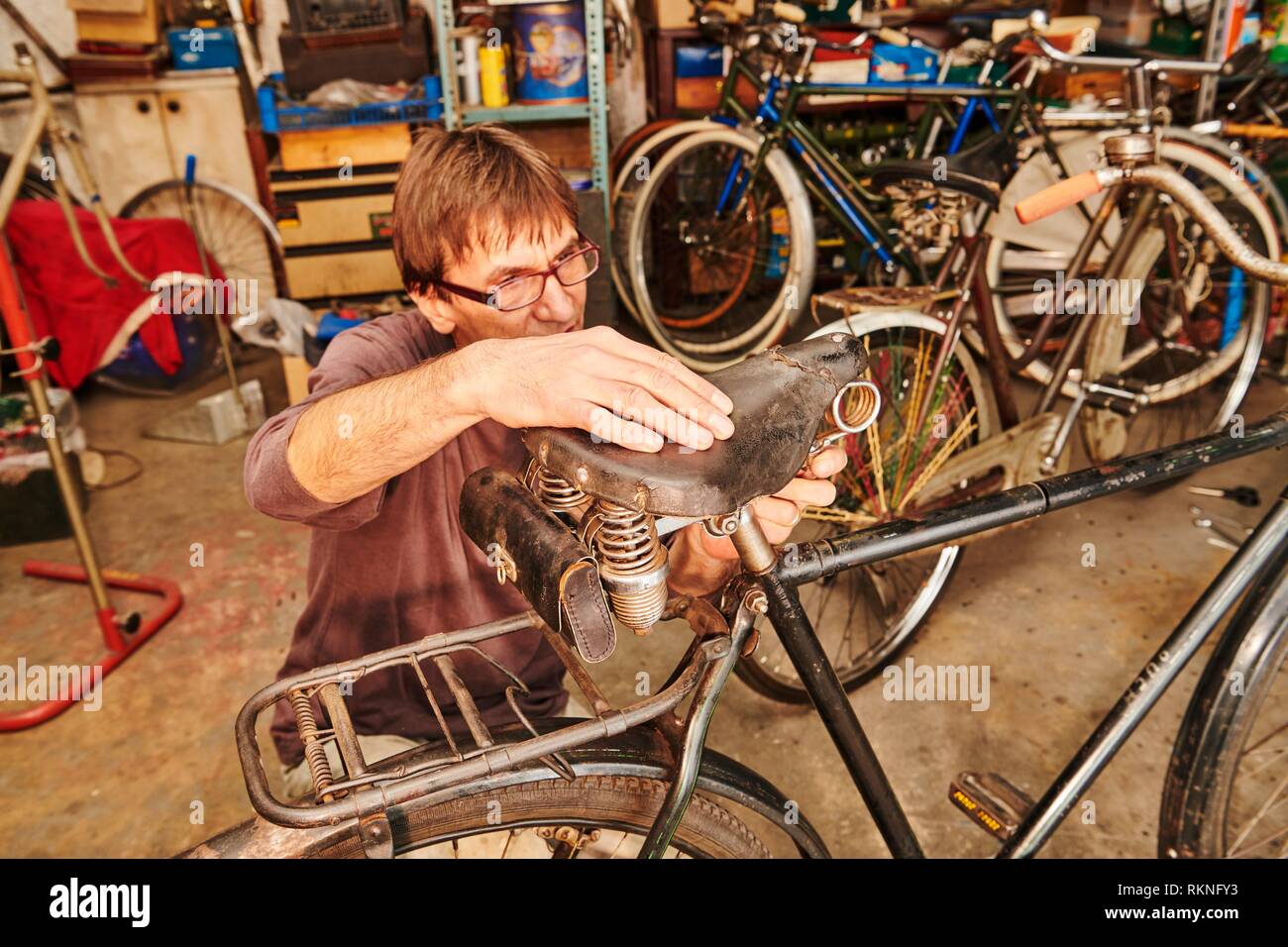 A technician restoring a vintage bicycle Stock Photo Alamy