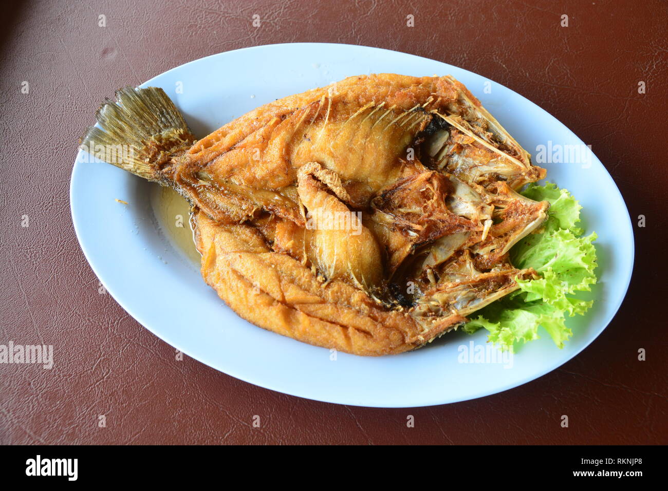 fried snapper fish with sweet fish sauce Stock Photo Alamy