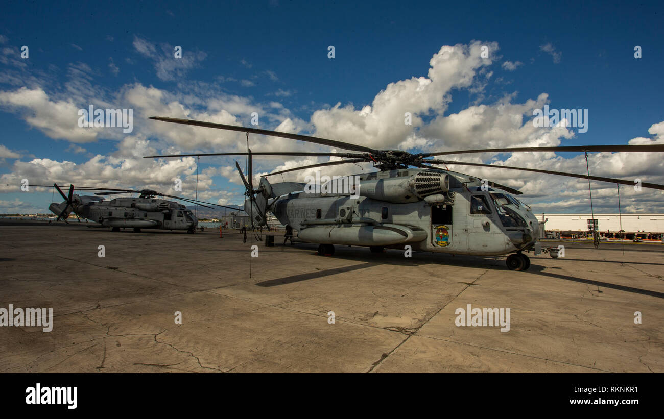 U.S. Marines with Marine Heavy Helicopter Squadron 363 (HMH-363) stage CH-53E Super Stallions on Pearl Harbor, Hawaii, Feb. 6, 2019. HMH-363 staged their aircraft prior to loading aircraft onto a ship for their upcoming deployment. (U.S. Marine Corps photo by Sgt. Ricky Gomez) Stock Photo