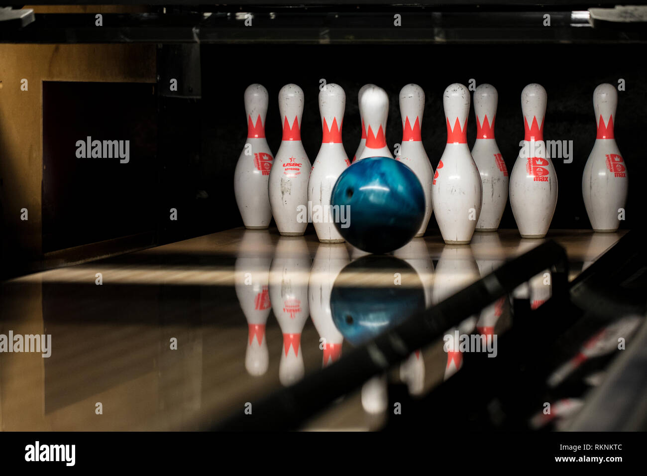 A bowling ball strikes pins at the Strike Zone bowling alley on Marine Corps Air Station Iwakuni, Japan, Feb. 7, 2019. Marine Corps Community Services, Single Marine Program, invited Japanese nationals from the Iwakuni Nursing Home to the air station for lunch and an afternoon of bowling. The event allowed both parties to share a cultural exchange through friendly competition and strengthen the everlasting bond between MCAS Iwakuni and the local community. (U.S. Marine Corps photo by Sgt. Joseph Abrego) Stock Photo