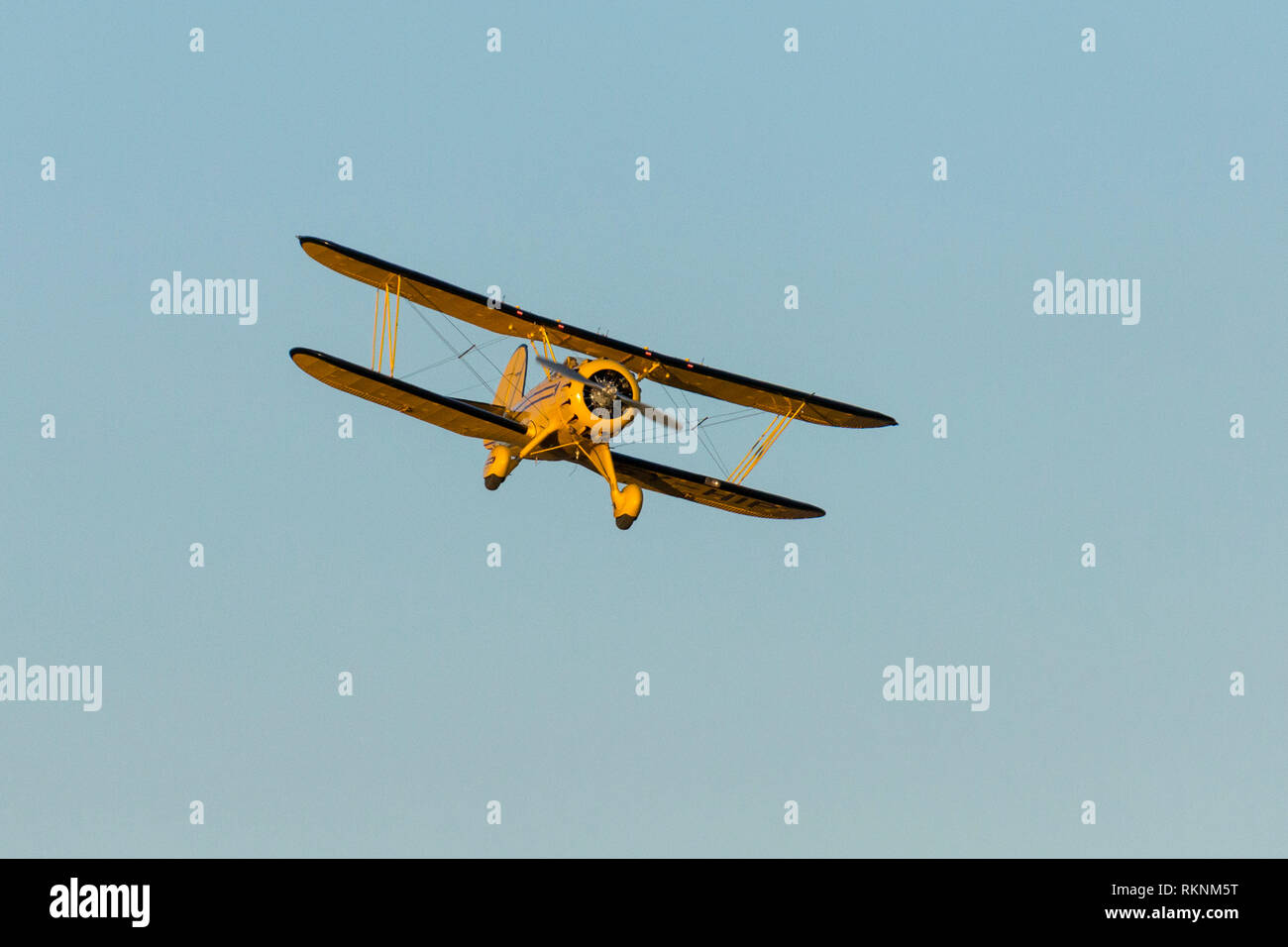 A 1930's Waco biplane flying at dawn, close view head on, Lewa  Wilderness,Lewa Conservancy, Kenya, Africa Stock Photo - Alamy