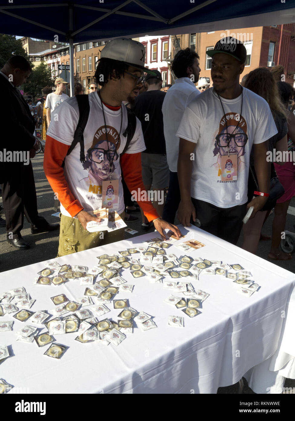 Distribution of free condoms at Spike Lee block party in the Bedford Stuyvesant section of Brooklyn, NY. Stock Photo