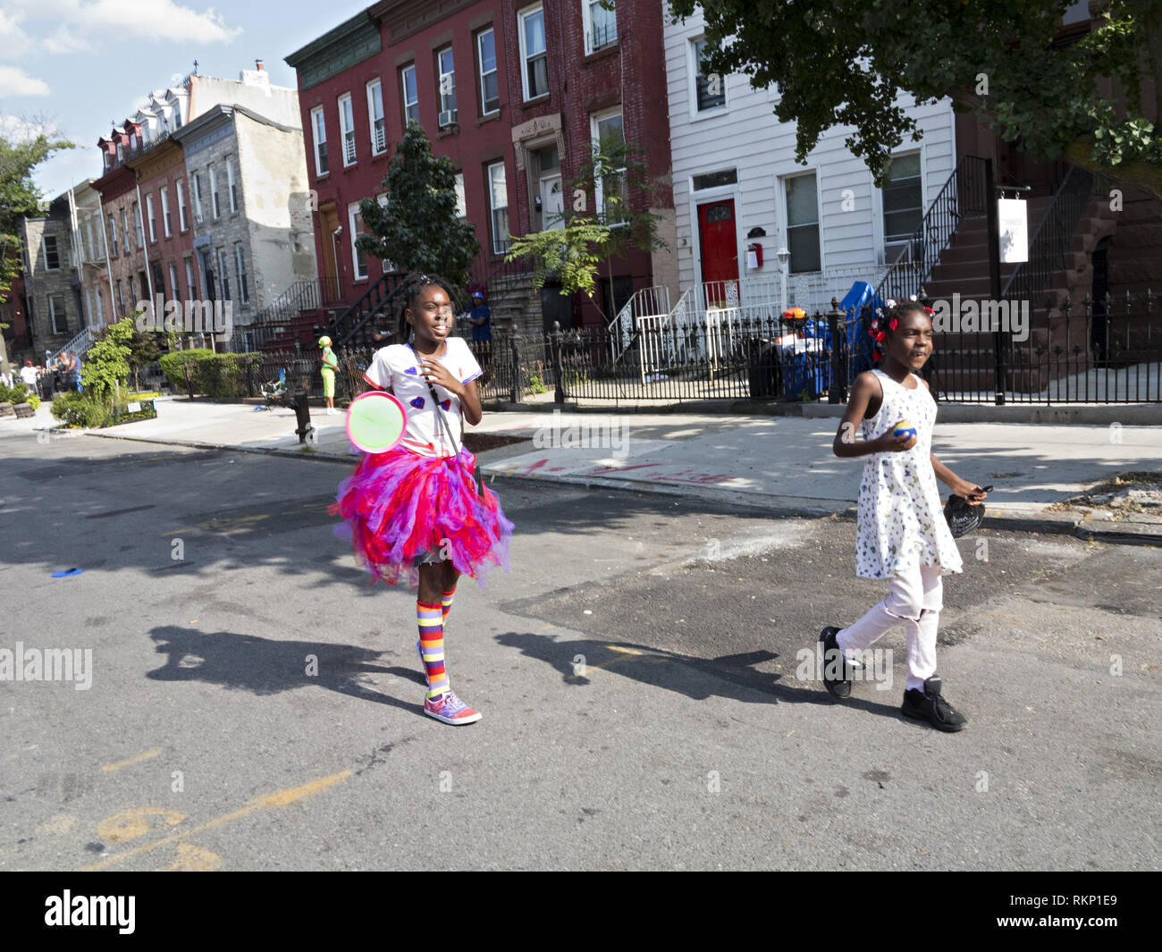 Children playing badminton tennis game at block party in the Bedford-Stuyvesant section of Brooklyn, NY. Stock Photo