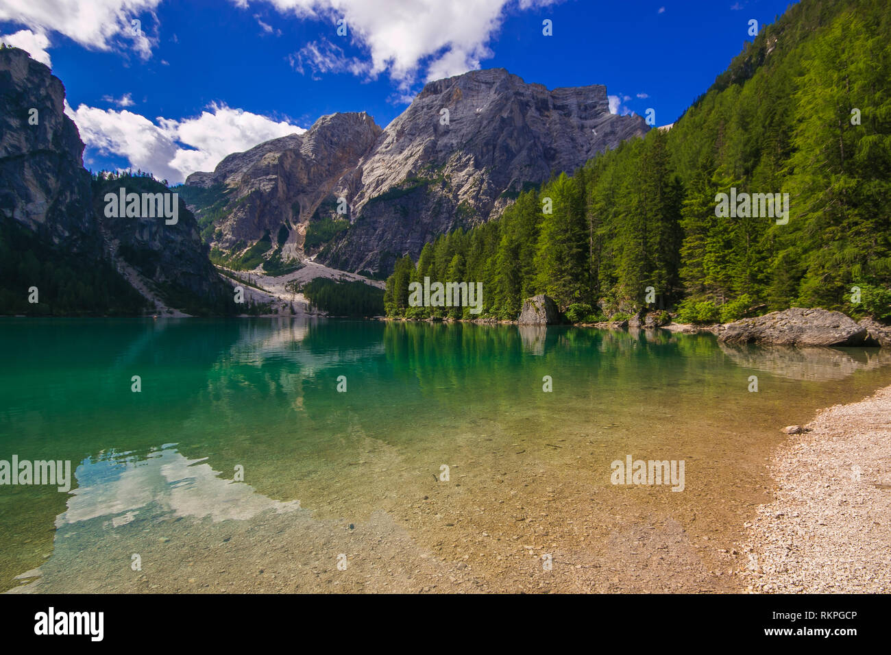 Braies lake is surrounded by the dolomites which are reflected in the water, Alto Adige, Italy Stock Photo
