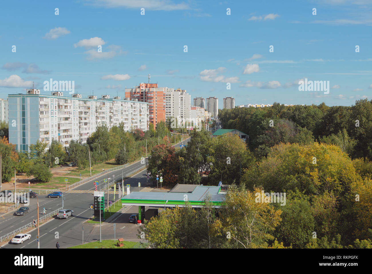 City street, fuel station and forest. Kazan, Russia Stock Photo