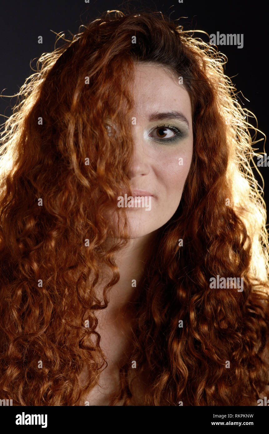 Portrait of young red haired caucasian woman with freckles Stock Photo