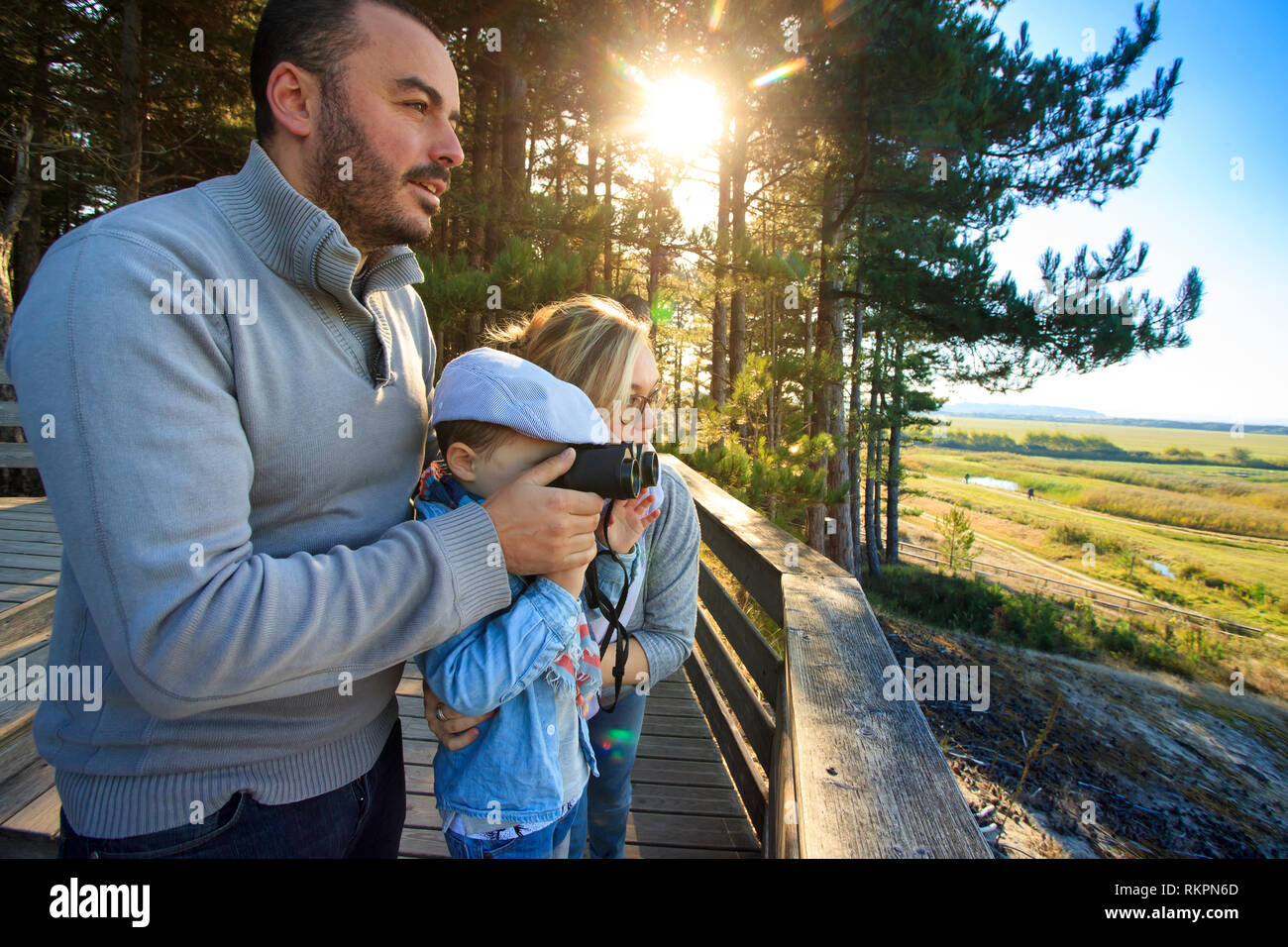Somme Bay (northern France): bird watching outing in the bird sanctuary 'Parc du Marquenterre', in Saint-Quentin-en-Tourmont. Family on an observation Stock Photo