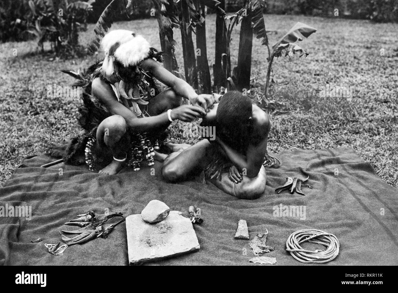 africa, congo, Zulu witch doctor treats a patient, 1930 Stock Photo