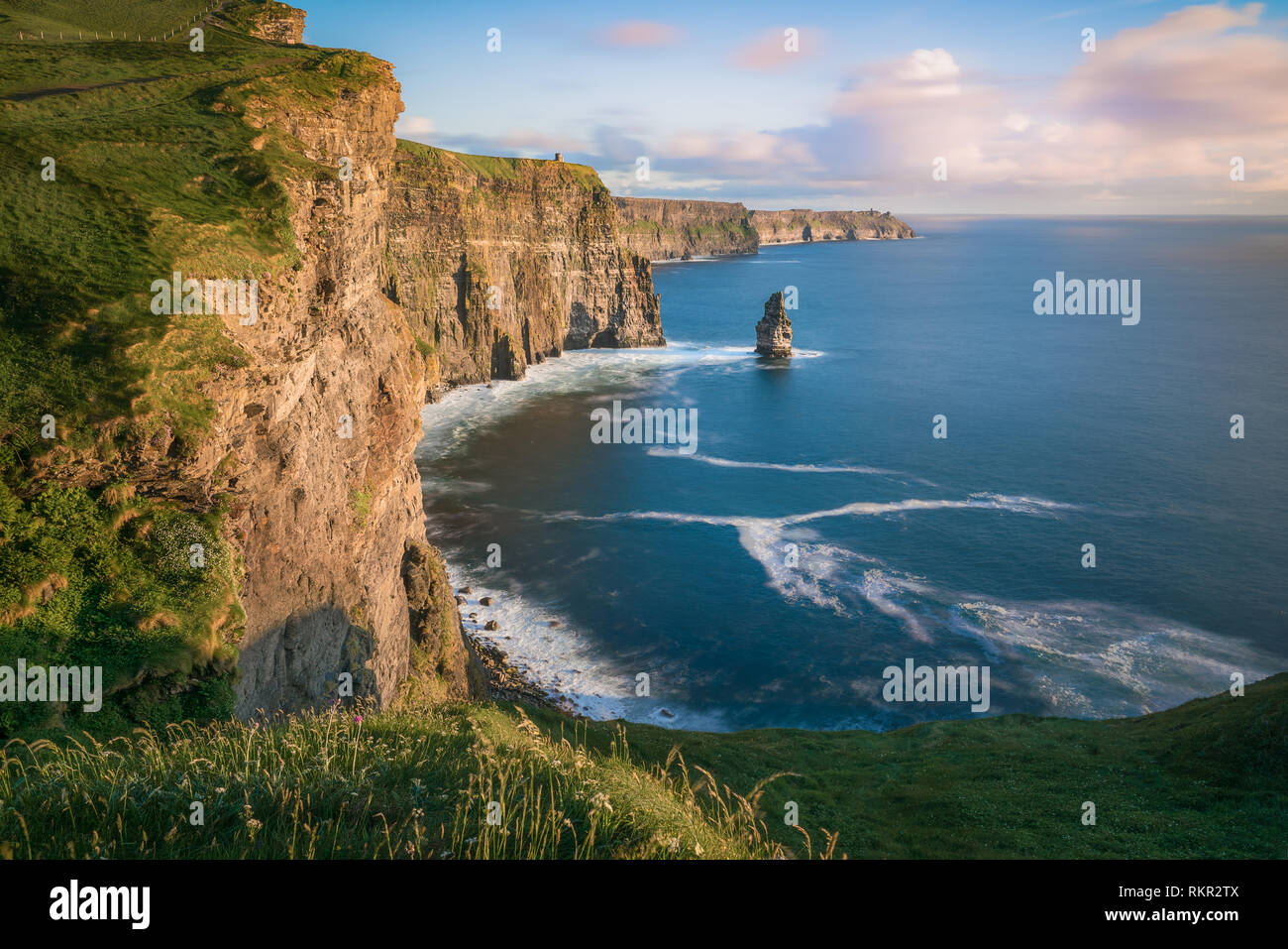 The spectacular Cliffs of Moher, in County Clare, are one of Ireland's most popular tourist attractions, receiving a million visitors a year. Stock Photo