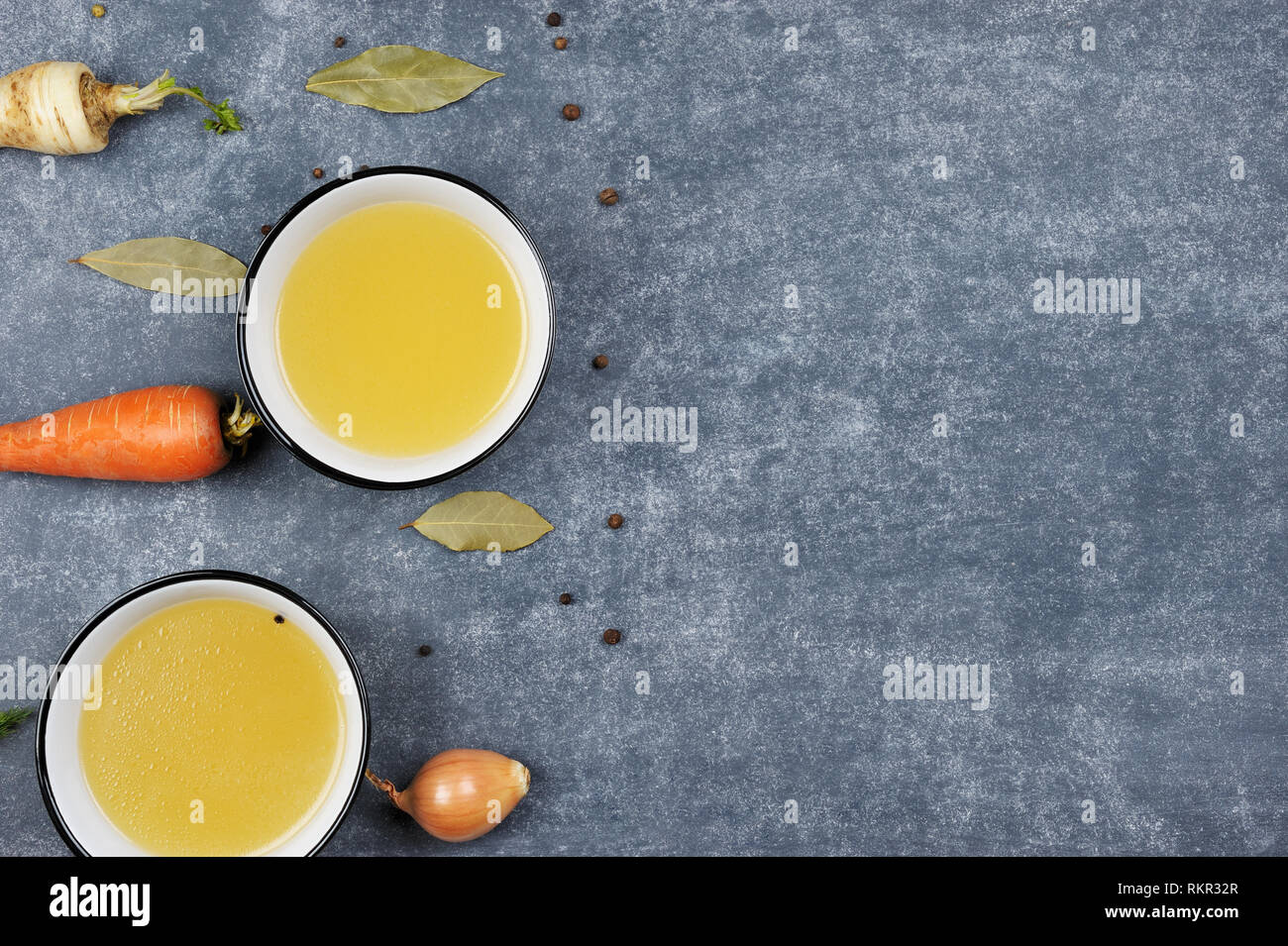 Broth with ingredient in the two bowls.Clear broth is made by simmering