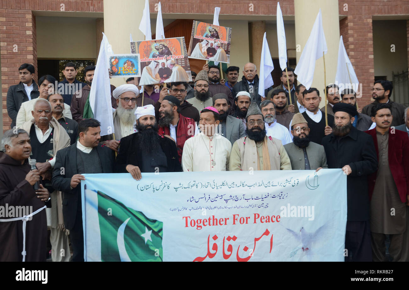 A “Peace Convoy” comprise of religious scholars from different faiths left for Ganda Singh border under interfaith dialogue from Catholic Church. All Religious scholars hold banner to shows solidarity during their travel from Lahore city to Ganda Singh as they are together to give a peace message, organized by National Commission for Inter-Religious Mukalma-wa-Bain-ul-Kalisai and Catholic Be-ship Conference Pakistan.Ganda Singh Border, which is a city in Punjab, Pakistan. Ganda Singh Border is an attractive and beautiful Historical place in Pakistan. Ganda Singh Wala is a village in Kasur Dist Stock Photo