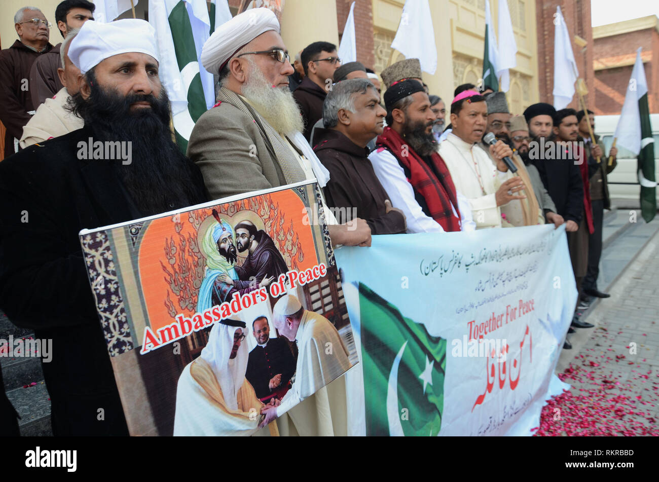 A “Peace Convoy” comprise of religious scholars from different faiths left for Ganda Singh border under interfaith dialogue from Catholic Church. All Religious scholars hold banner to shows solidarity during their travel from Lahore city to Ganda Singh as they are together to give a peace message, organized by National Commission for Inter-Religious Mukalma-wa-Bain-ul-Kalisai and Catholic Be-ship Conference Pakistan.Ganda Singh Border, which is a city in Punjab, Pakistan. Ganda Singh Border is an attractive and beautiful Historical place in Pakistan. Ganda Singh Wala is a village in Kasur Dist Stock Photo
