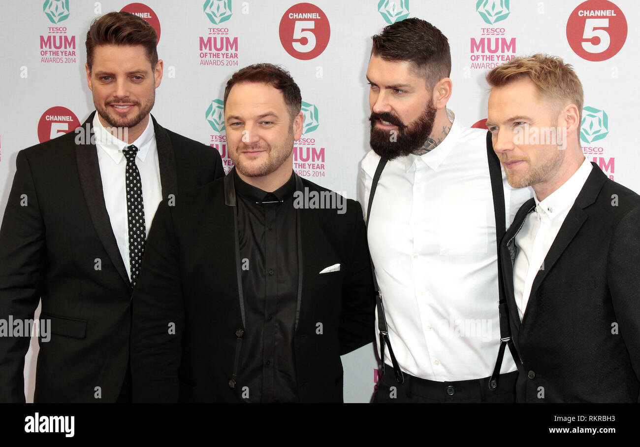 Keith Duffy, Mikey Graham, Shane Lynch and Ronan Keating of Boyzone attend the Tesco Mum of the Year awards at The Savoy Hotel Stock Photo
