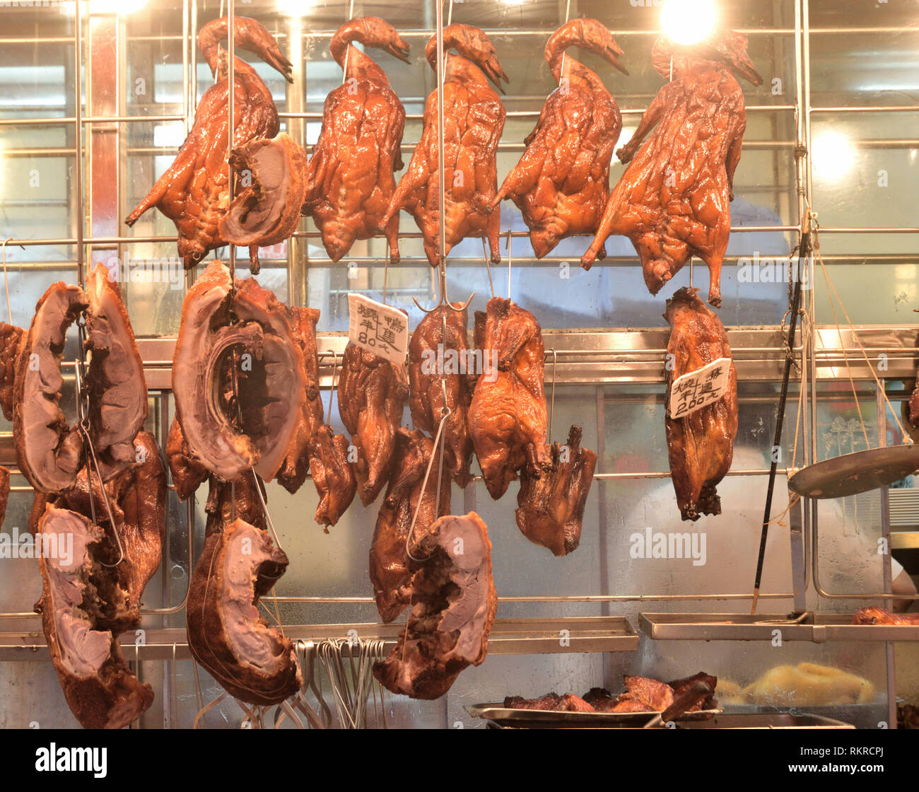 Cantonese style barbecued meat on rack Stock Photo