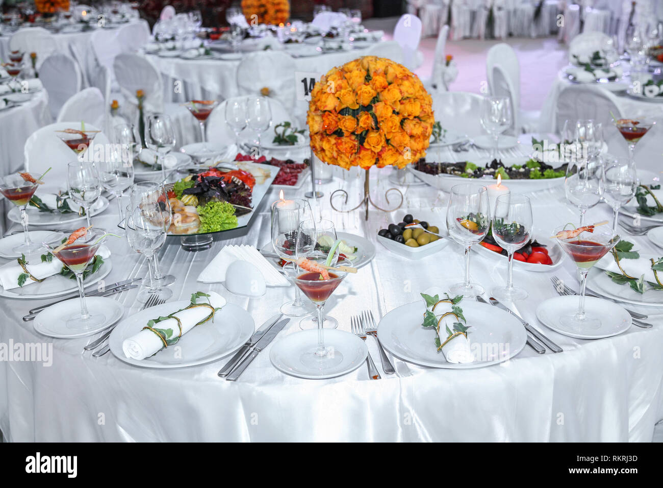 Holiday table setting decorated with flowers and candles Stock Photo ...