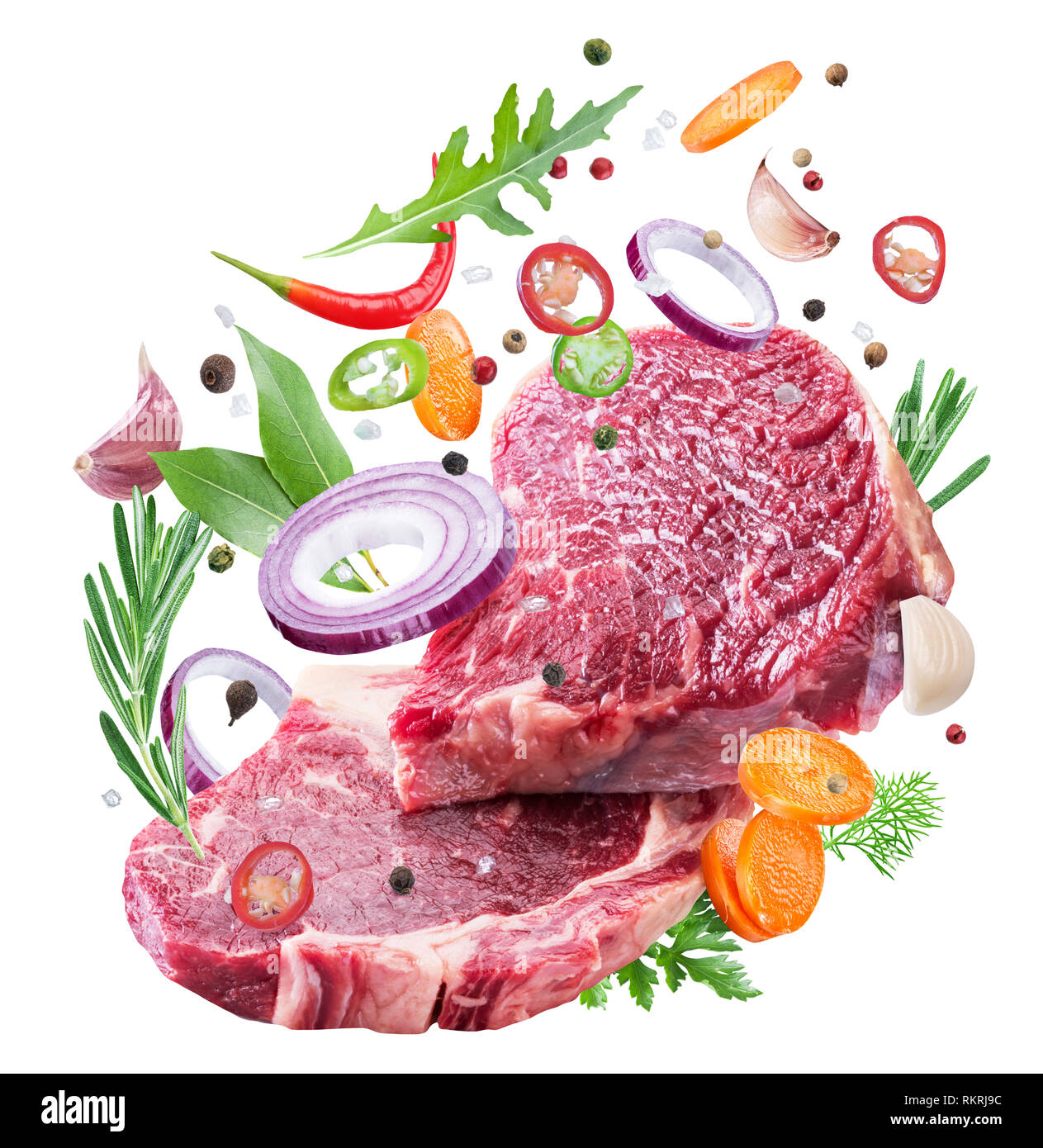 Falling down meat steaks and spices. Flying motion effect of cooking