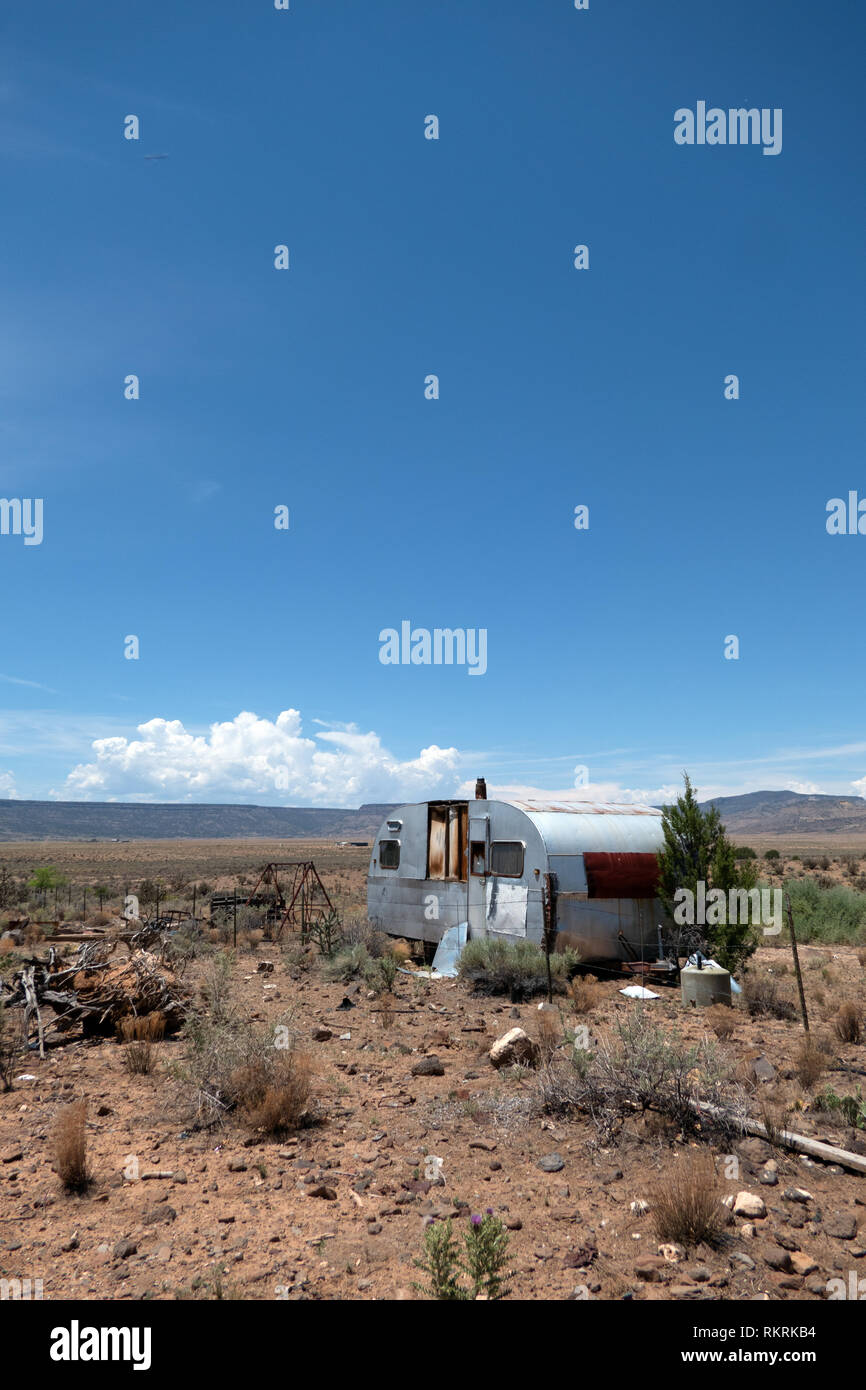 Abandoned trailer in the desert near San Fidel, New Mexico, United States of America. View of a small American village in the Southwest US. Summer lan Stock Photo