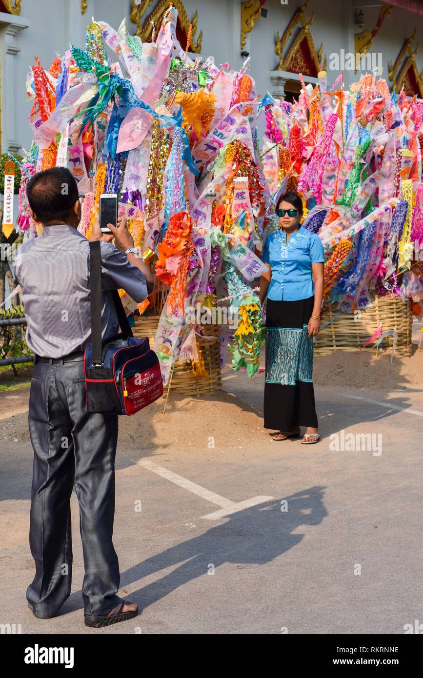 Thai People taking pictures during temple visit, Chiang ai, Thailand Stock Photo