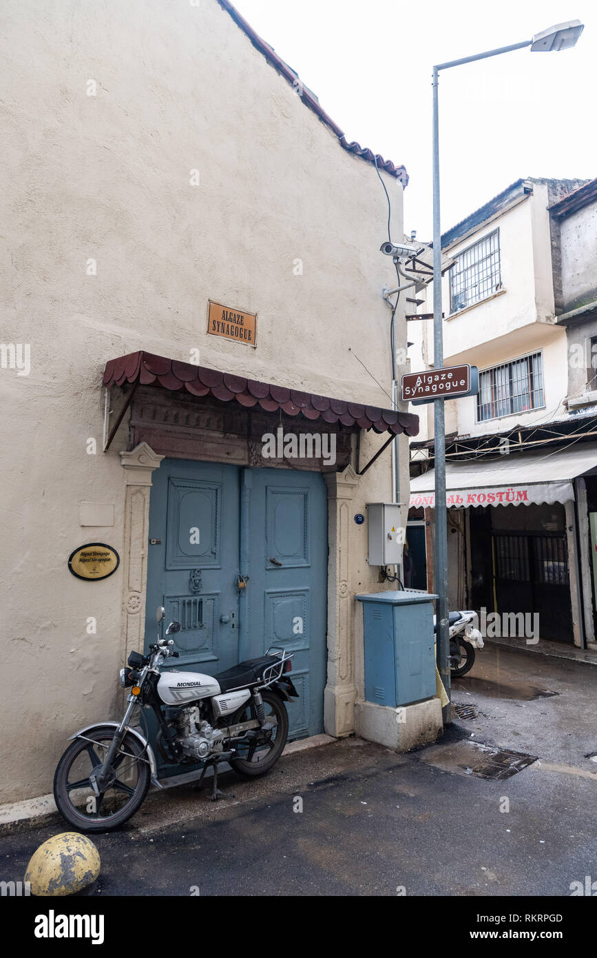 Izmir, Turkey - January 26, 2019. Exterior view of Algaze Synagogue in Izmir, with motorbike and commercial properties. Algaze synagogue dates from th Stock Photo