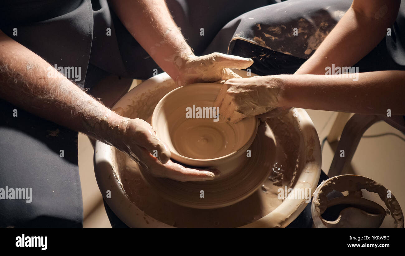 Pottery couple hands making clay jug, 4k. close up Stock Photo Alamy