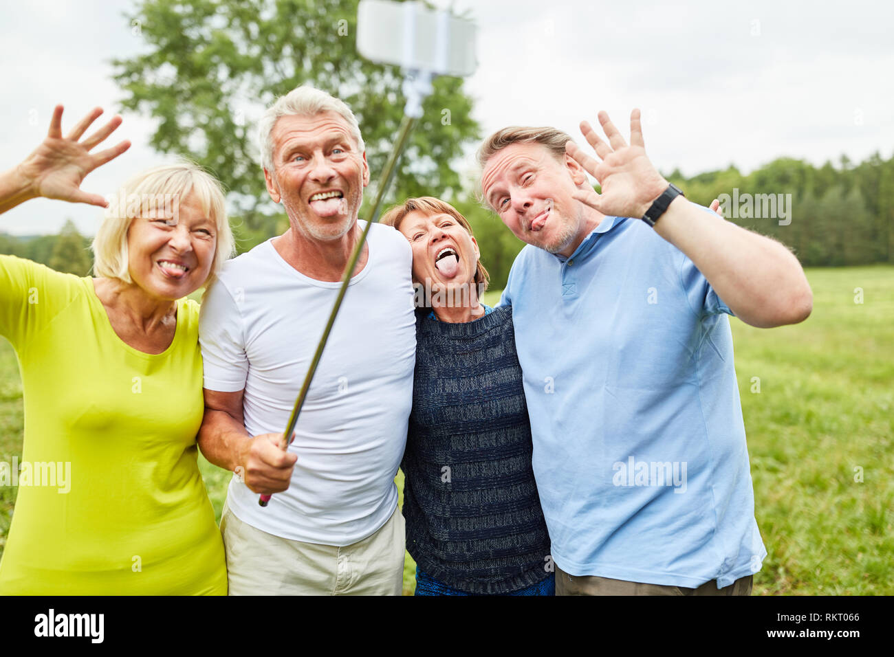 Cheerful seniors make faces and silly around for the selfie photo Stock Photo