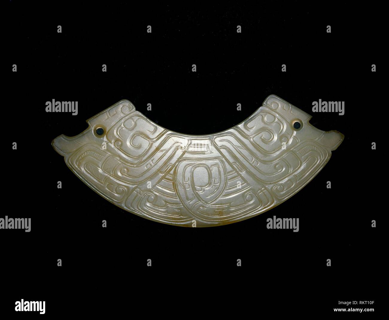 Arc-shaped pendant (huang) - Western Zhou period, 9th/8th century B.C. - China - Origin: China, Date: 900 BC–700 BC, Medium: Jade, Dimensions: 3.5 × Stock Photo