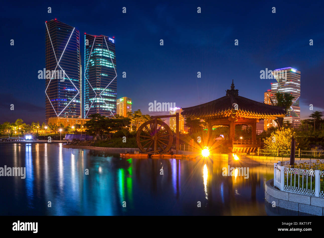 traditional and modern architecture of seoul city after sunset, central park in songdo International business district, Incheon South Korea. Stock Photo
