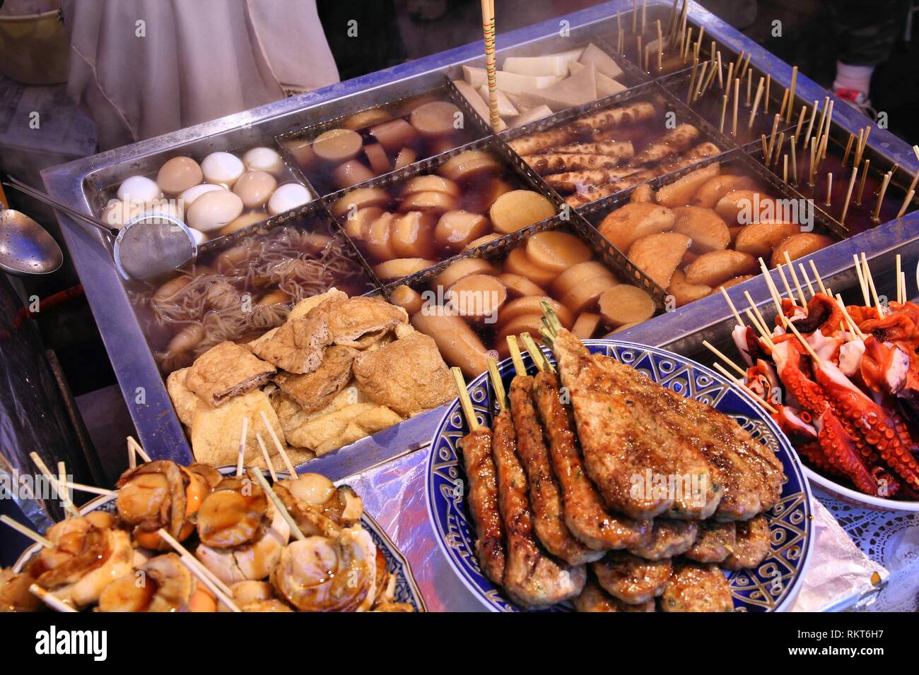 Japanese cuisine - fried chicken, squid, eggs, dumplings and other food Stock Photo