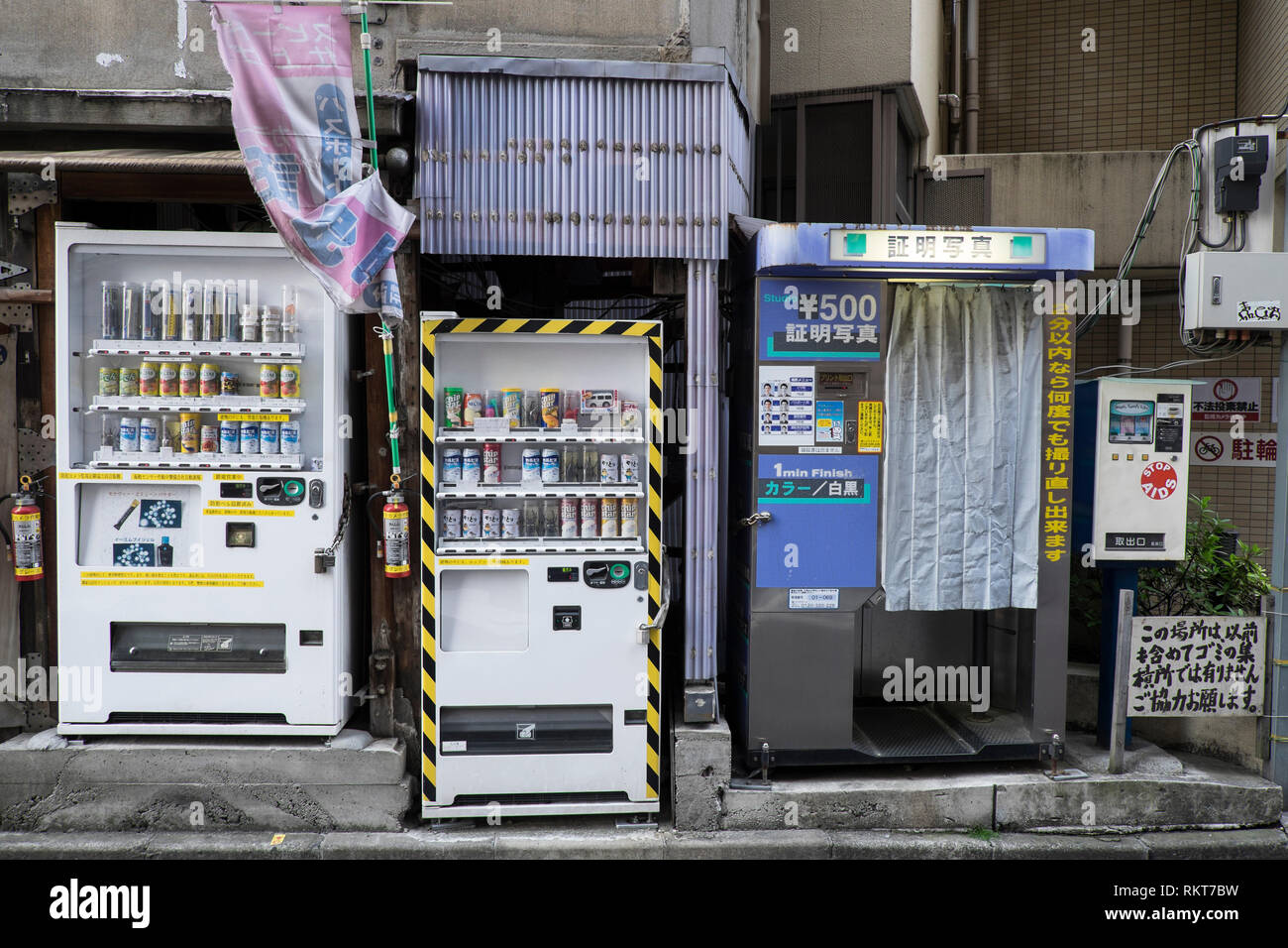 Japan, Tokyo: drink and condom vending machines and photo booth in the district of Kanda *** Local Caption *** Stock Photo