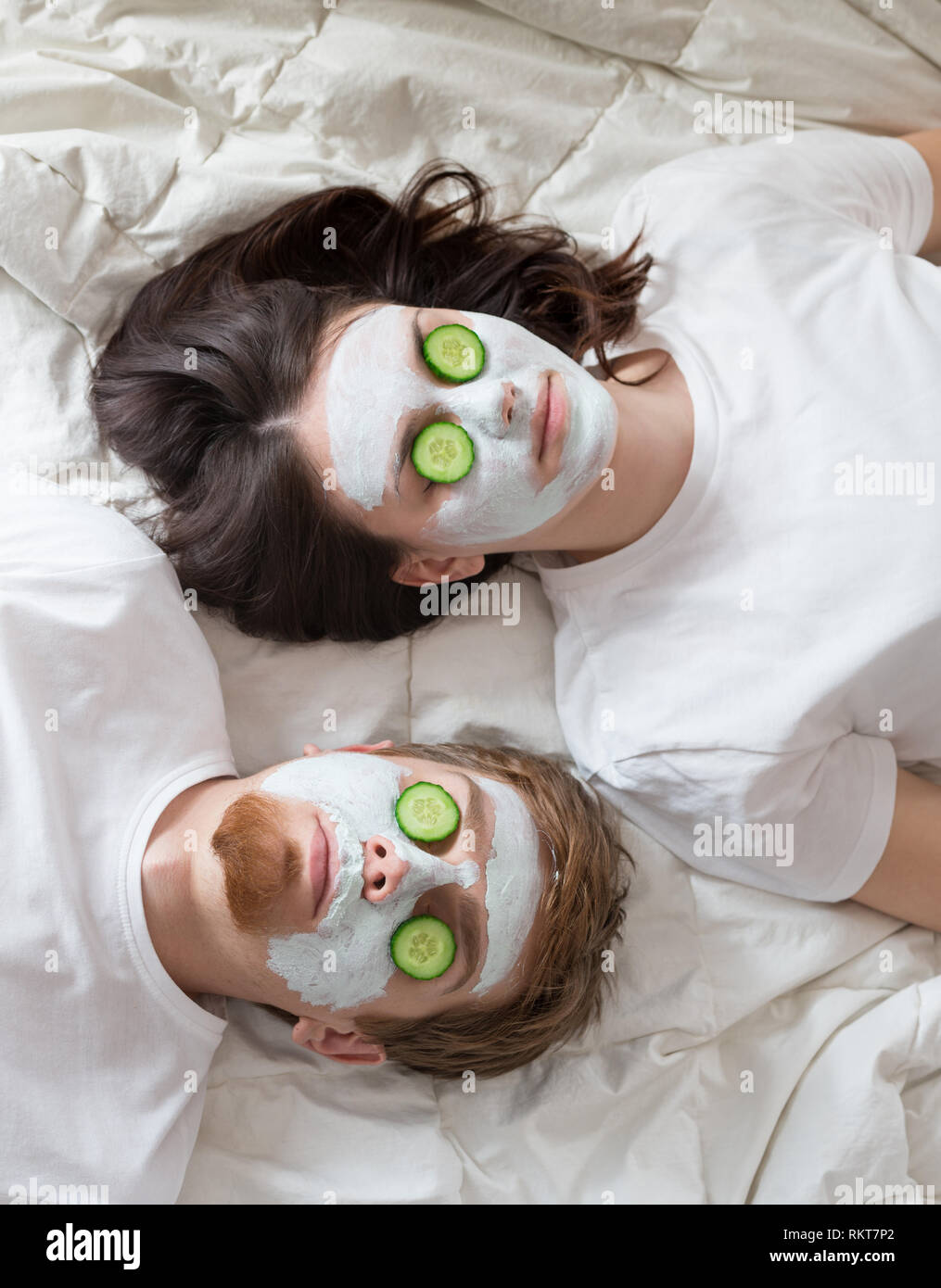 Couple getting homemade facial mask Stock Photo
