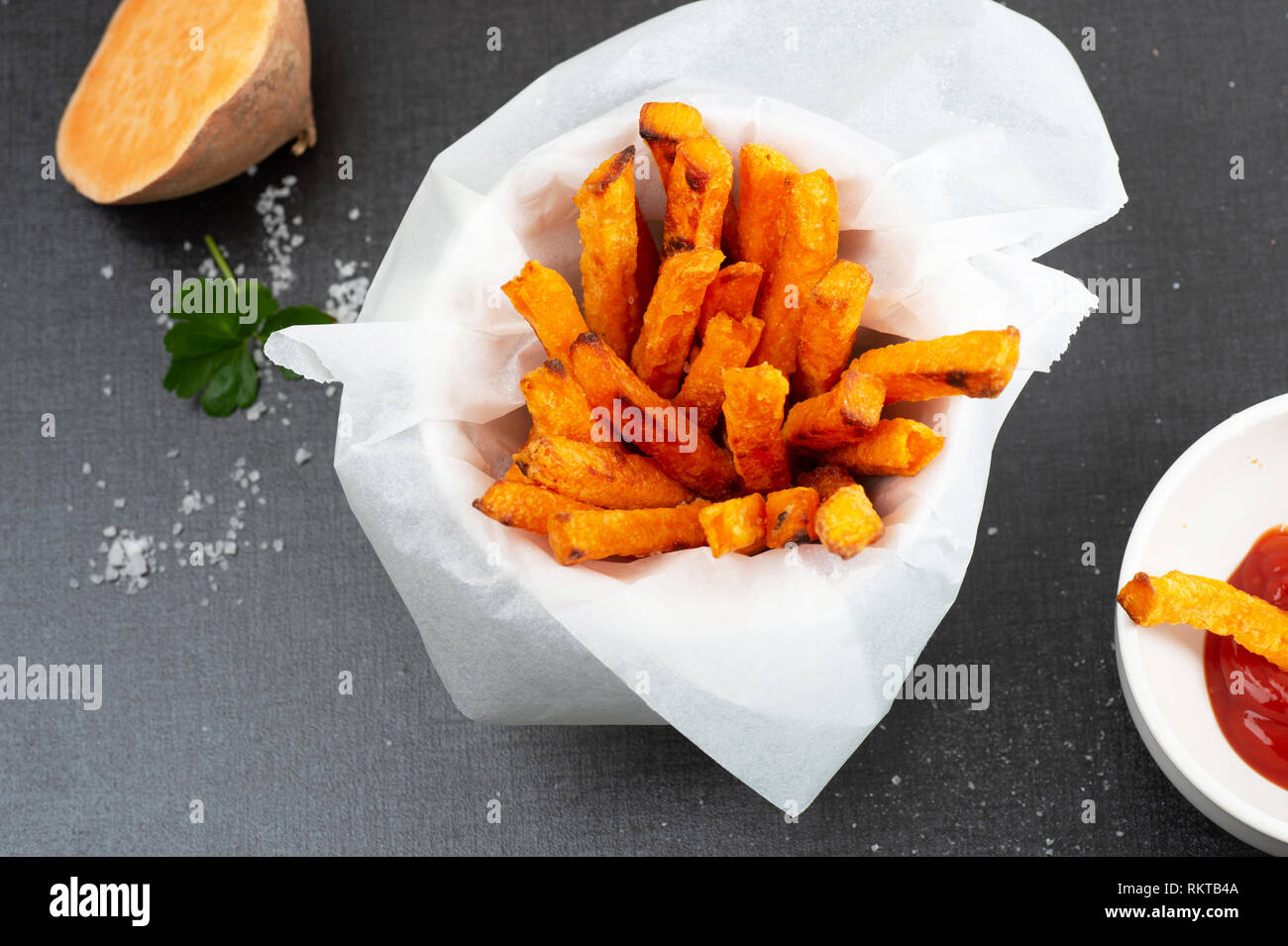 Homemade oven baked sweet and juicy, sweet potato fries. Ketchup and