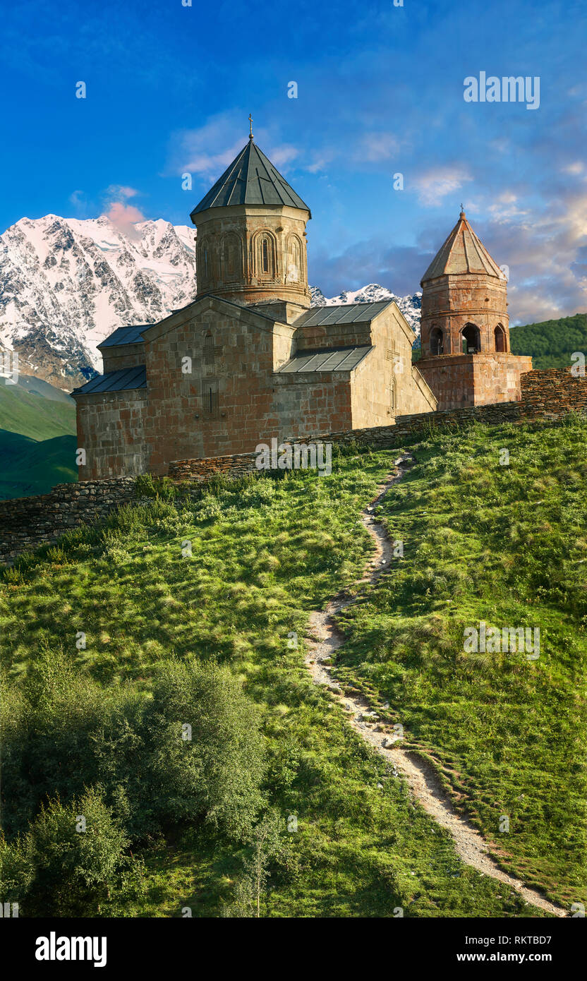 Pictures & images of Gergeti Holy Trinity (Tsminda Sameba) Georgian Orthodox and Apostolic Church and bell tower, 14th century, Gergeti, Khevi provinc Stock Photo