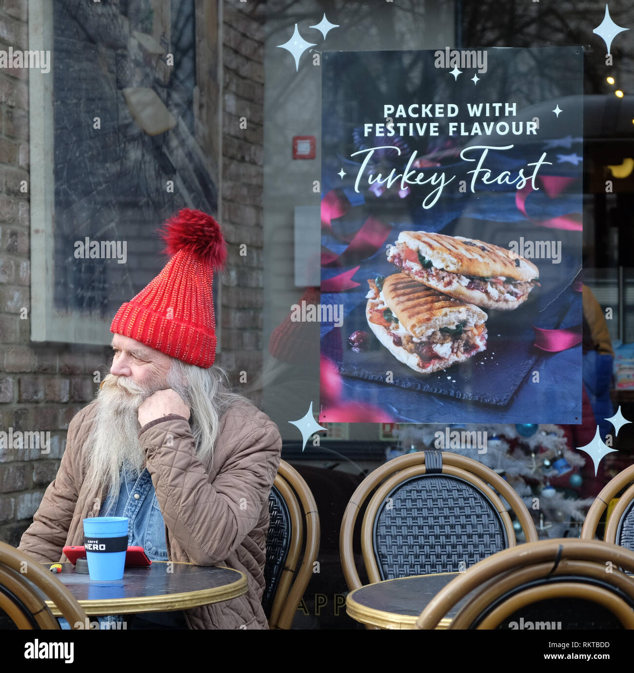 Christmas in Belfast, man in red woollen hat, Donegall Square West, Belfast. Stock Photo
