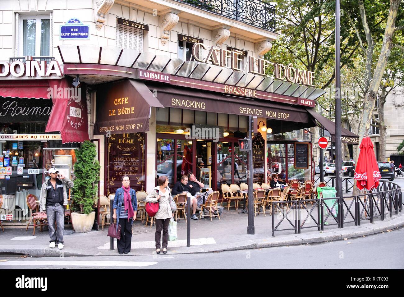 PARIS - JULY 21: People visit Cafe Le Dome on July 21, 2011 in Paris, France. Le Dome cafe is a typical establishment for Paris, one of largest metrop Stock Photo